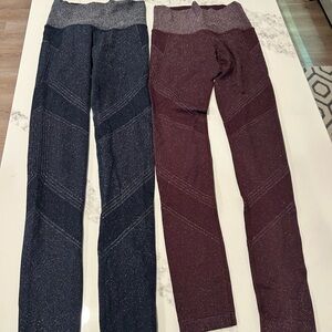 Athleta 1 Navy Blue and 1 Burgundy pair of  twilight leggings. Buy one get one